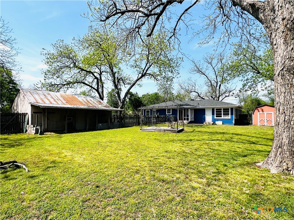 1307 West Main Street Cameron, TX 76520 - Photo 23 of 24 a front view of a house with a yard