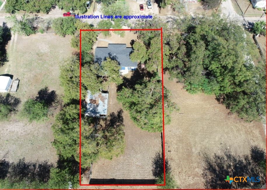 1307 West Main Street Cameron, TX 76520 - Photo 8 of 24 an aerial view of a house with a yard and lake view