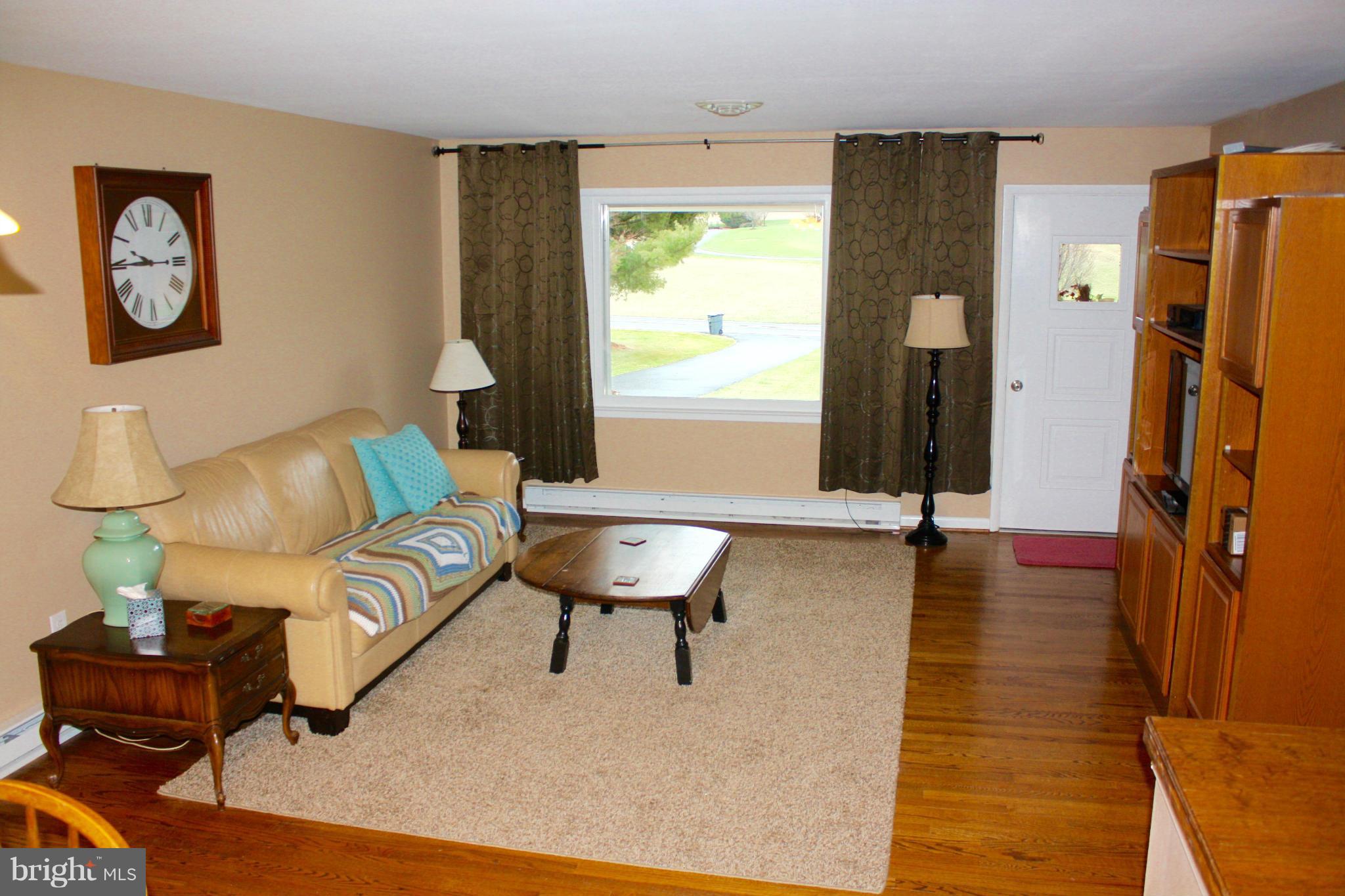28400 Clarksburg Road Damascus, MD 20872 - Photo 3 of 16 a living room with furniture and a wooden floor