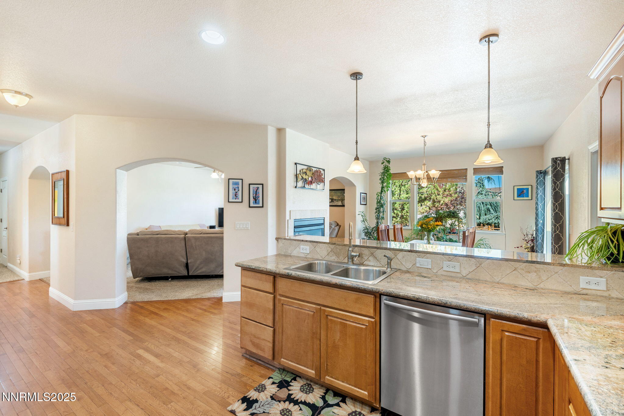 306 San Roma Drive Dayton, NV 89403 - Photo 22 of 46 a open kitchen with stainless steel appliances granite countertop a sink a window and a counter top space