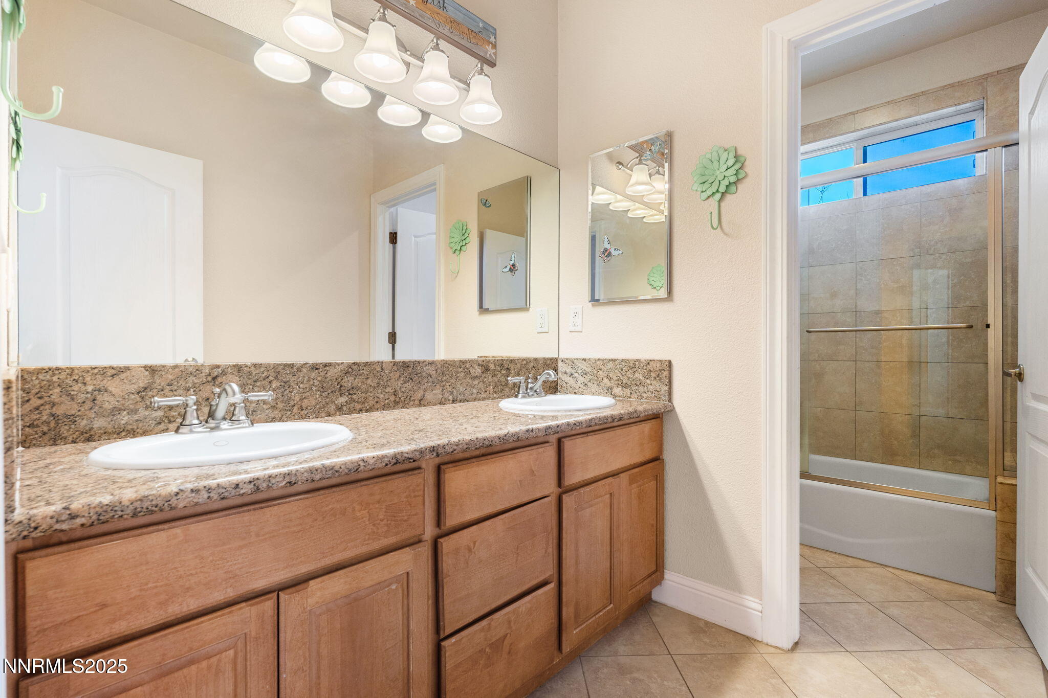 306 San Roma Drive Dayton, NV 89403 - Photo 33 of 46 a bathroom with a granite countertop sink and a mirror