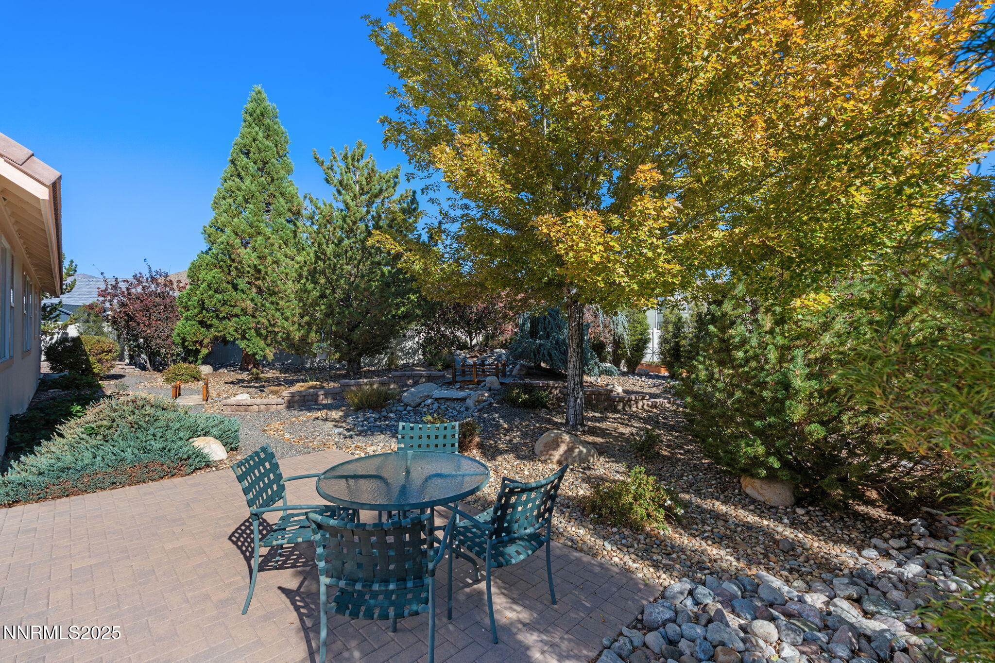 306 San Roma Drive Dayton, NV 89403 - Photo 39 of 46 a view of a patio with table and chairs and potted plants