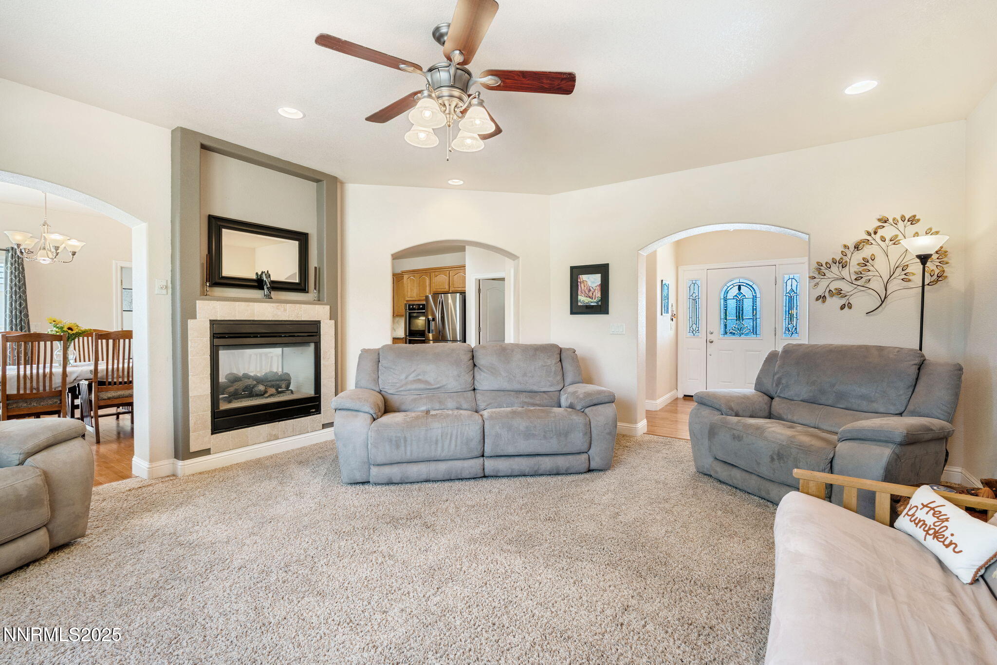 306 San Roma Drive Dayton, NV 89403 - Photo 6 of 46 a living room with furniture and a fireplace