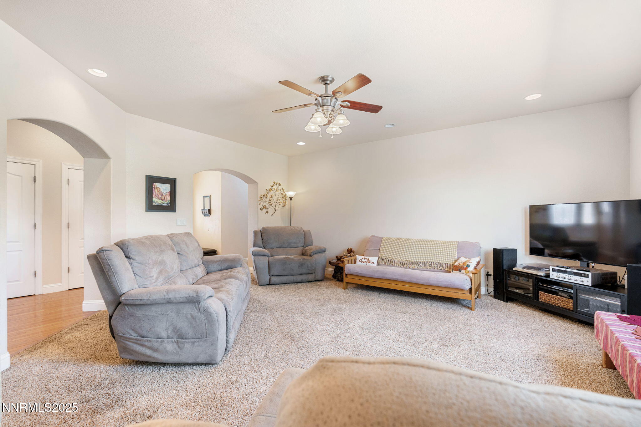 306 San Roma Drive Dayton, NV 89403 - Photo 7 of 46 a living room with furniture and a flat screen tv