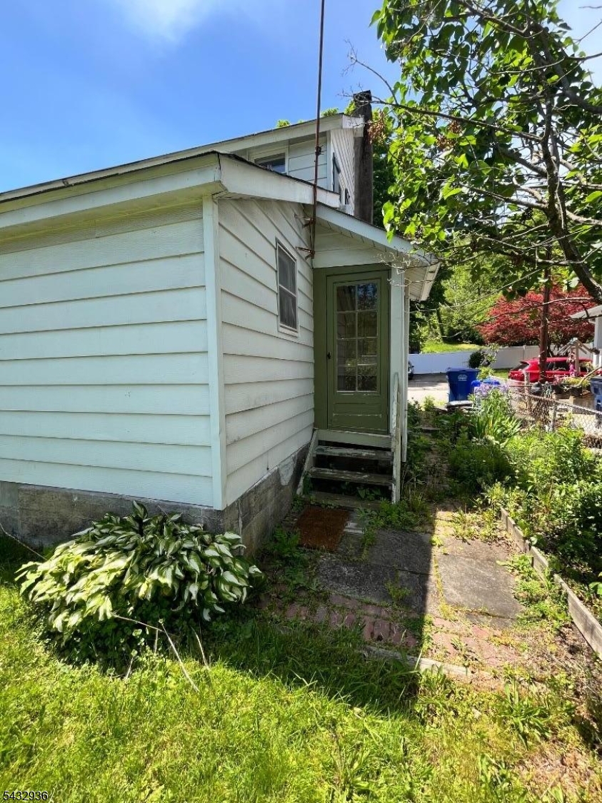 9 New Row Road, Unit A Hibernia, NJ 07842 - Photo 15 of 18 a view of a house with a backyard