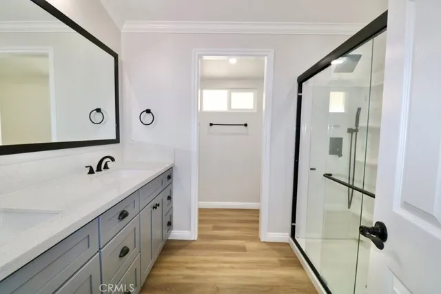 a bathroom with a double vanity sink