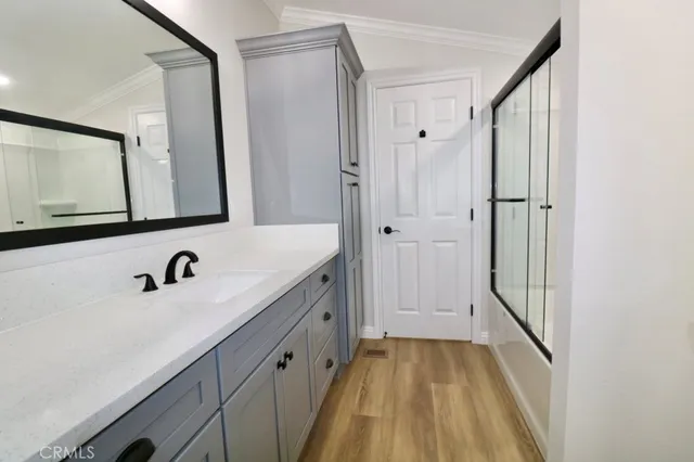 a bathroom with a sink and mirror