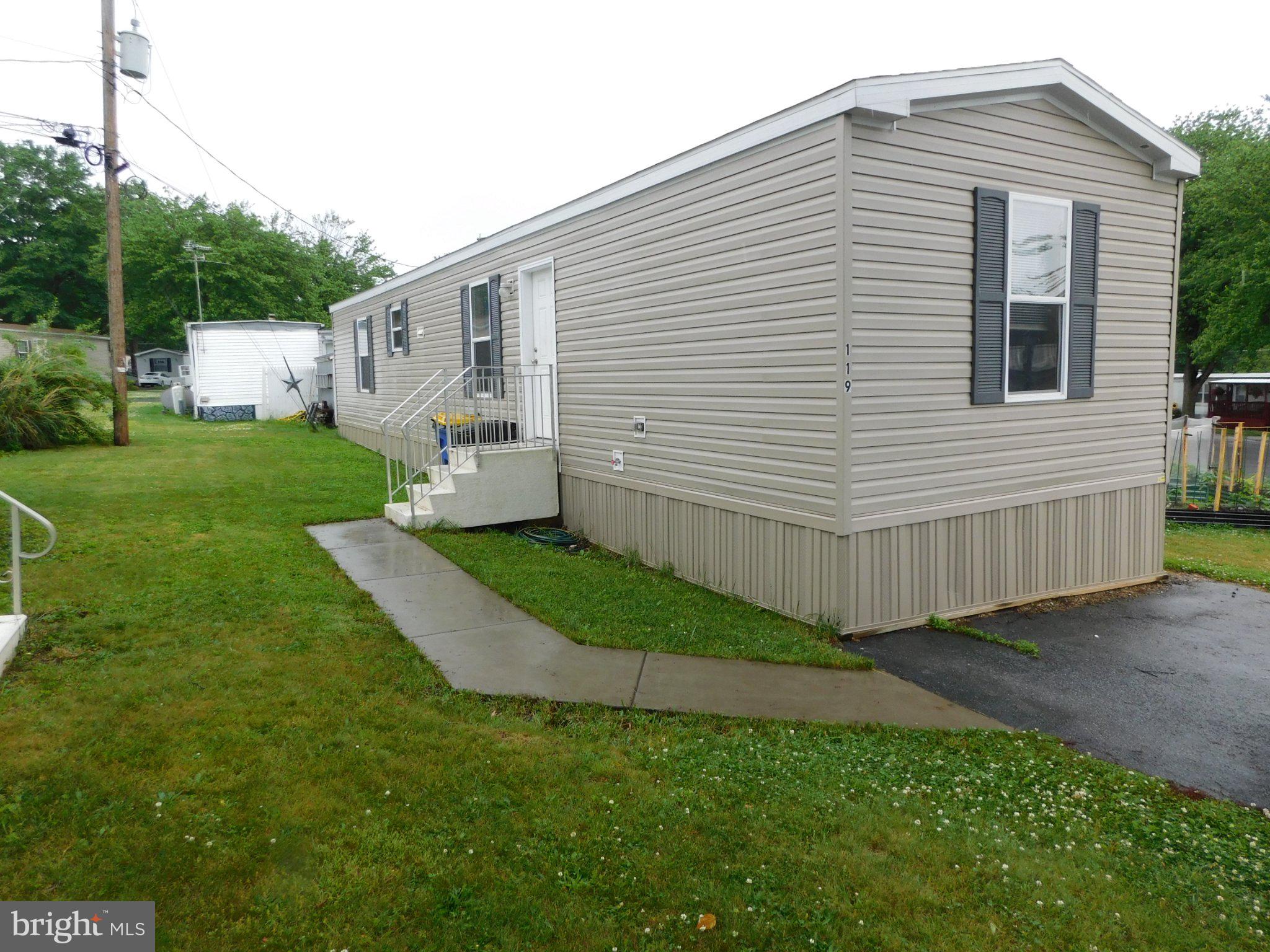 119 Meadow Lane Lititz, PA 17543 - Photo 1 of 13 a front view of a house with a yard
