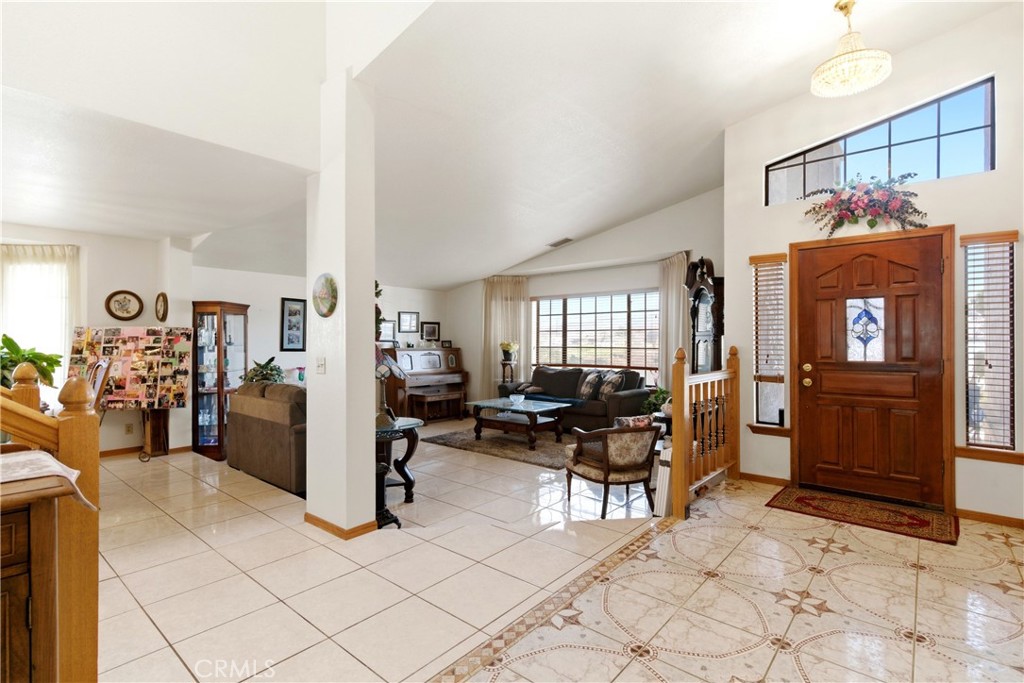 11468 Kiowa Road Apple Valley, CA 92308 - Photo 14 of 73 a living room with furniture a dining table and chairs with wooden floor