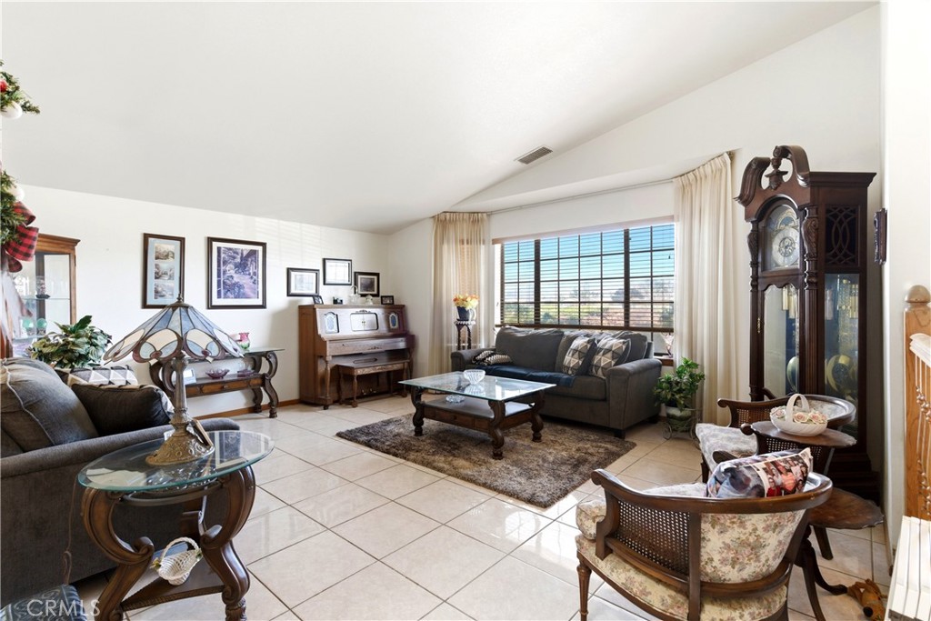 11468 Kiowa Road Apple Valley, CA 92308 - Photo 15 of 73 a living room with furniture and a large window