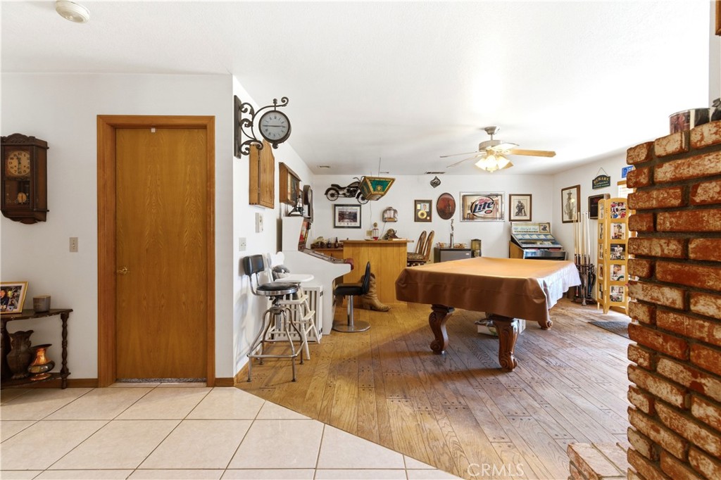 11468 Kiowa Road Apple Valley, CA 92308 - Photo 37 of 73 a living room with lots of furniture and a wooden floor