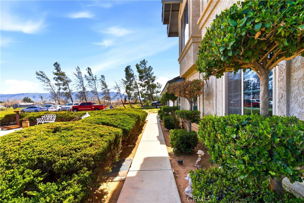 11468 Kiowa Road Apple Valley, CA 92308 - Photo 4 of 73 a view of a house with a yard