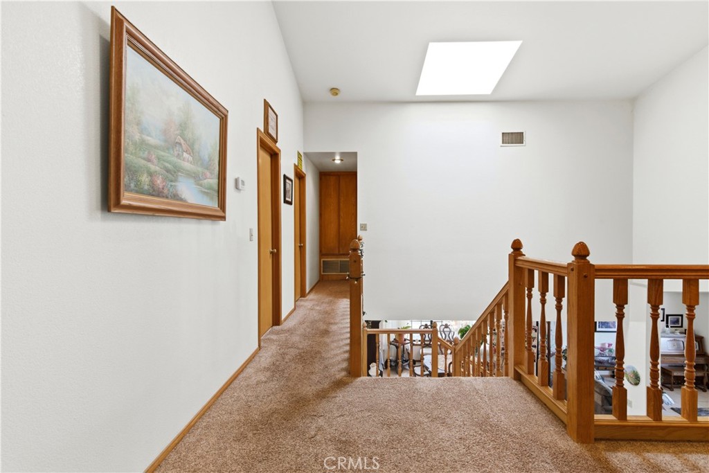 11468 Kiowa Road Apple Valley, CA 92308 - Photo 49 of 73 a view of hallway with wooden floor