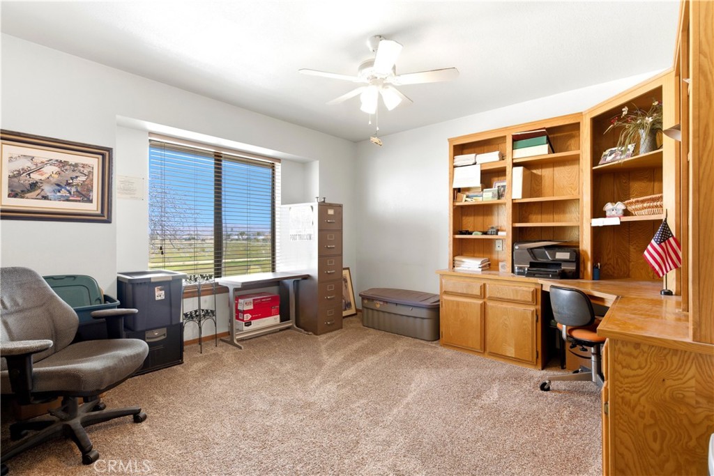 11468 Kiowa Road Apple Valley, CA 92308 - Photo 61 of 73 a living room with furniture cabinets and a flat screen tv