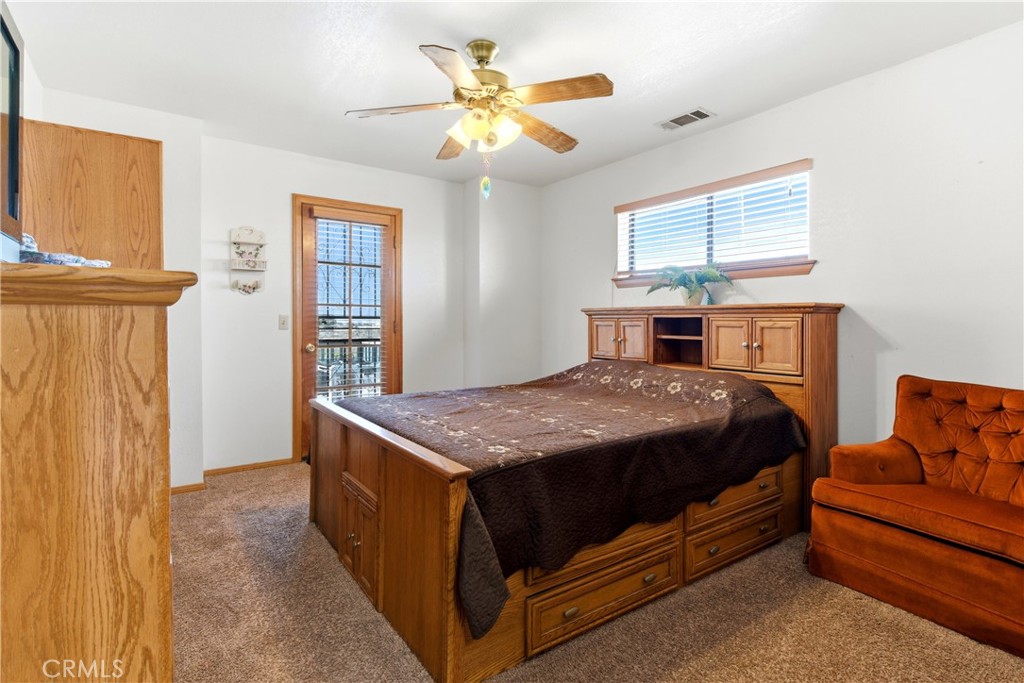 11468 Kiowa Road Apple Valley, CA 92308 - Photo 63 of 73 a bedroom with a bed and window