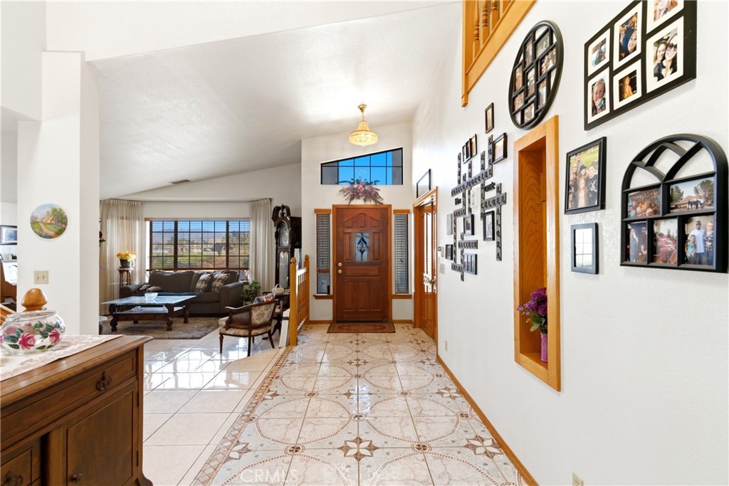 11468 Kiowa Road Apple Valley, CA 92308 - Photo 7 of 73 a lobby with furniture and a potted plant
