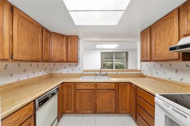 a bed room with a bed mirror and a dresser
