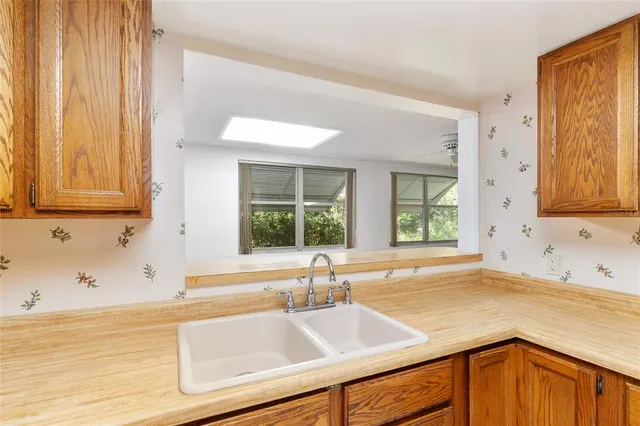 a bathroom with a sink mirror and toilet