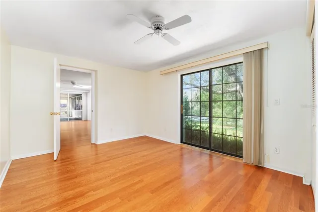 a view of a utility room with closet cabinets and a window