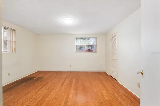 a kitchen with granite countertop white cabinets and a sink
