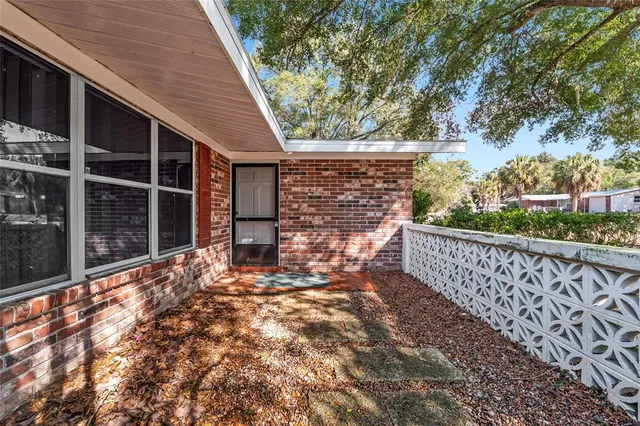 a view of balcony with wooden floor and fence
