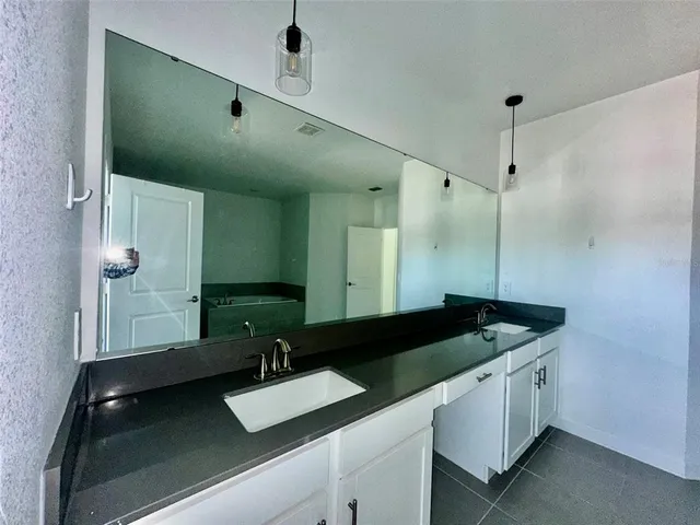 a bathroom with a tub and shower