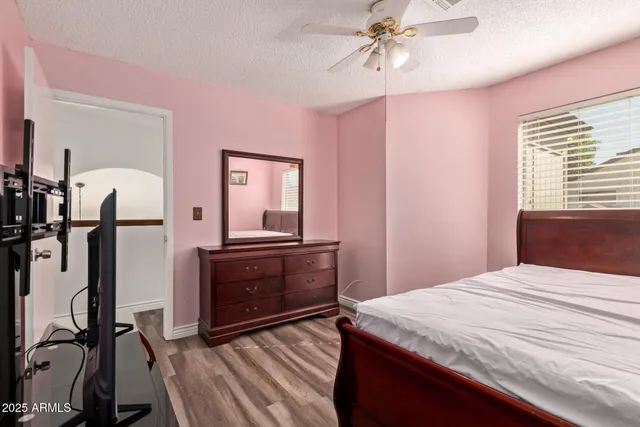 a bedroom with a bed and a dresser