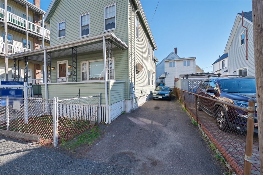 2 Perry Place Everett, MA 02149 - Photo 16 of 16 a view of a house with wooden fence
