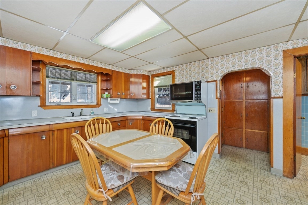 2 Perry Place Everett, MA 02149 - Photo 4 of 16 a view of a dining room with furniture window and wooden floor