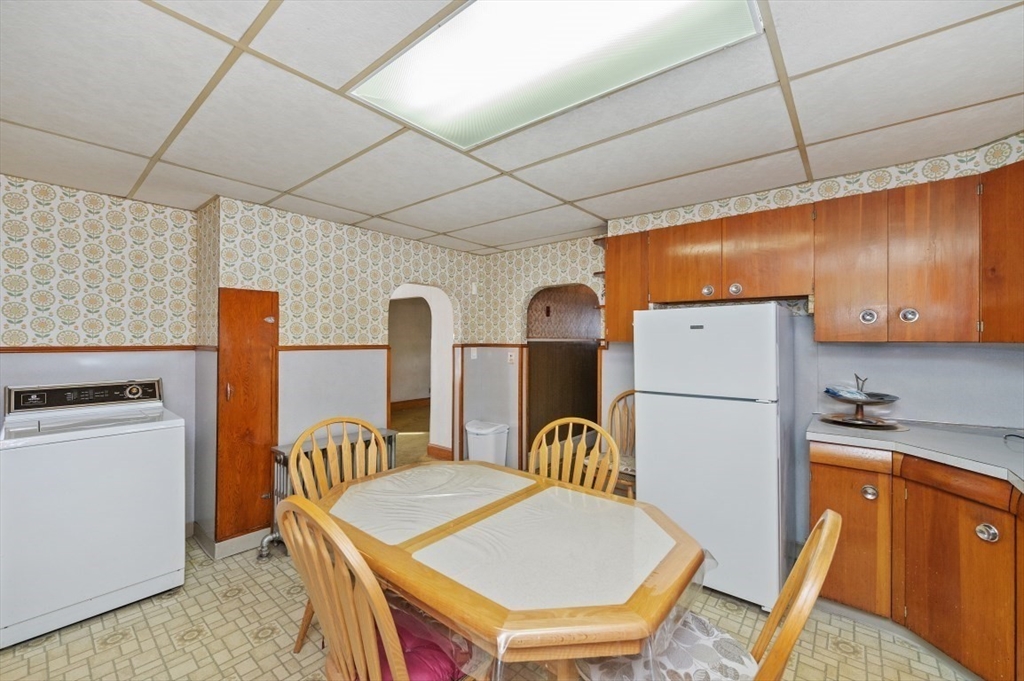 2 Perry Place Everett, MA 02149 - Photo 5 of 16 a kitchen that has a refrigerator a stove and a refrigerator