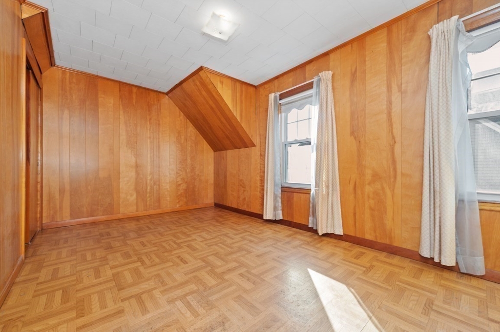 2 Perry Place Everett, MA 02149 - Photo 7 of 16 a view of a room with a wooden walls