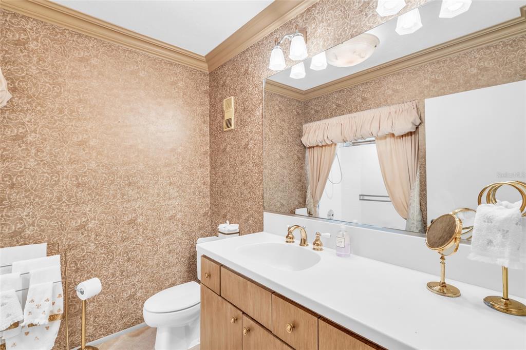 1920 Virginia Avenue, Unit 902 Fort Myers, FL 33901 - Photo 29 of 50 a bathroom with a sink and a mirror