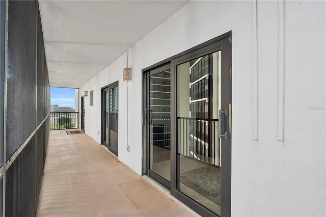 a view of a living room hardwood floor and a balcony