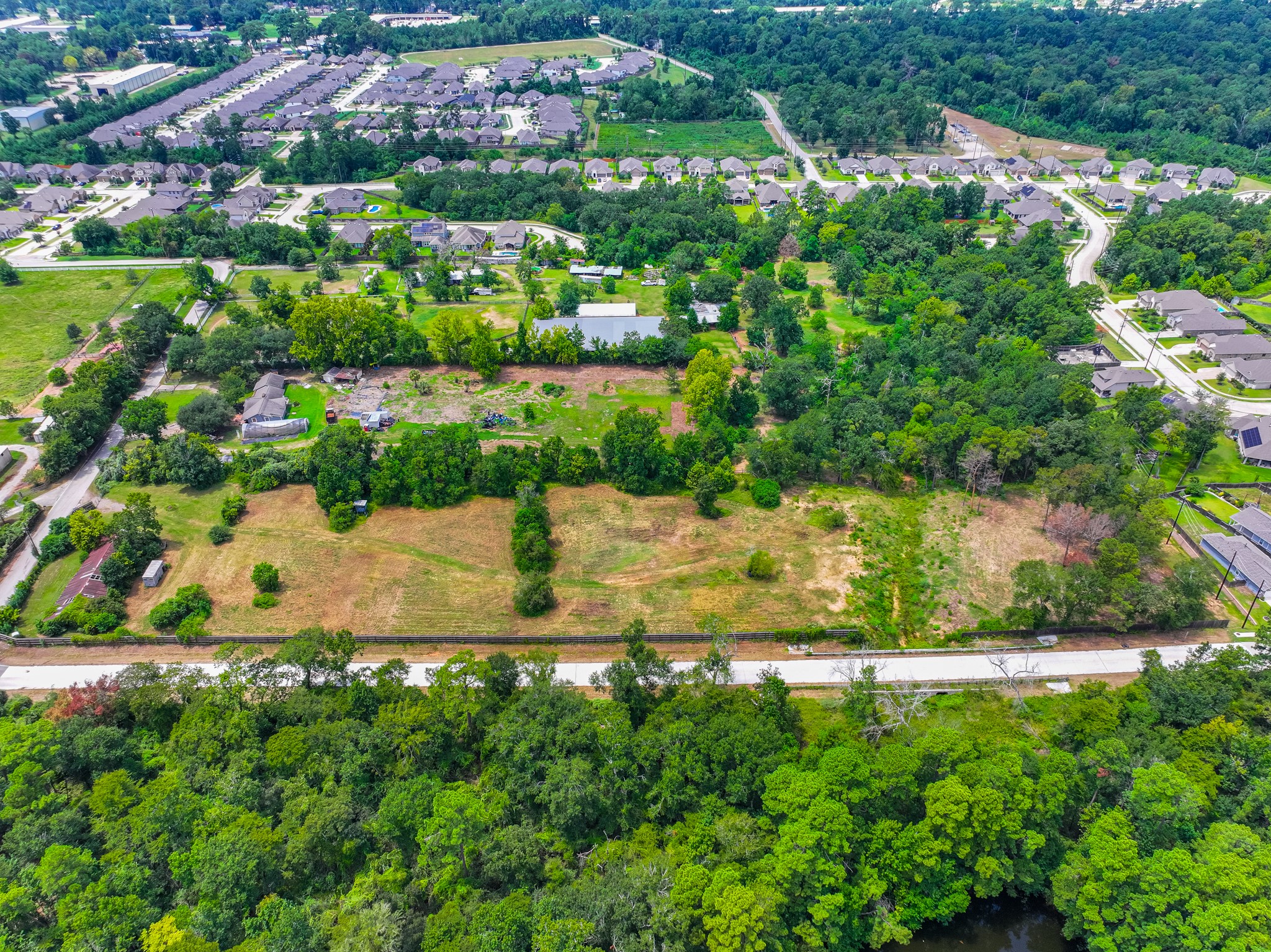 25635 Hufsmith Cemetery Road Tomball, TX 77375 - Photo 19 of 50 an aerial view of residential houses with outdoor space and trees