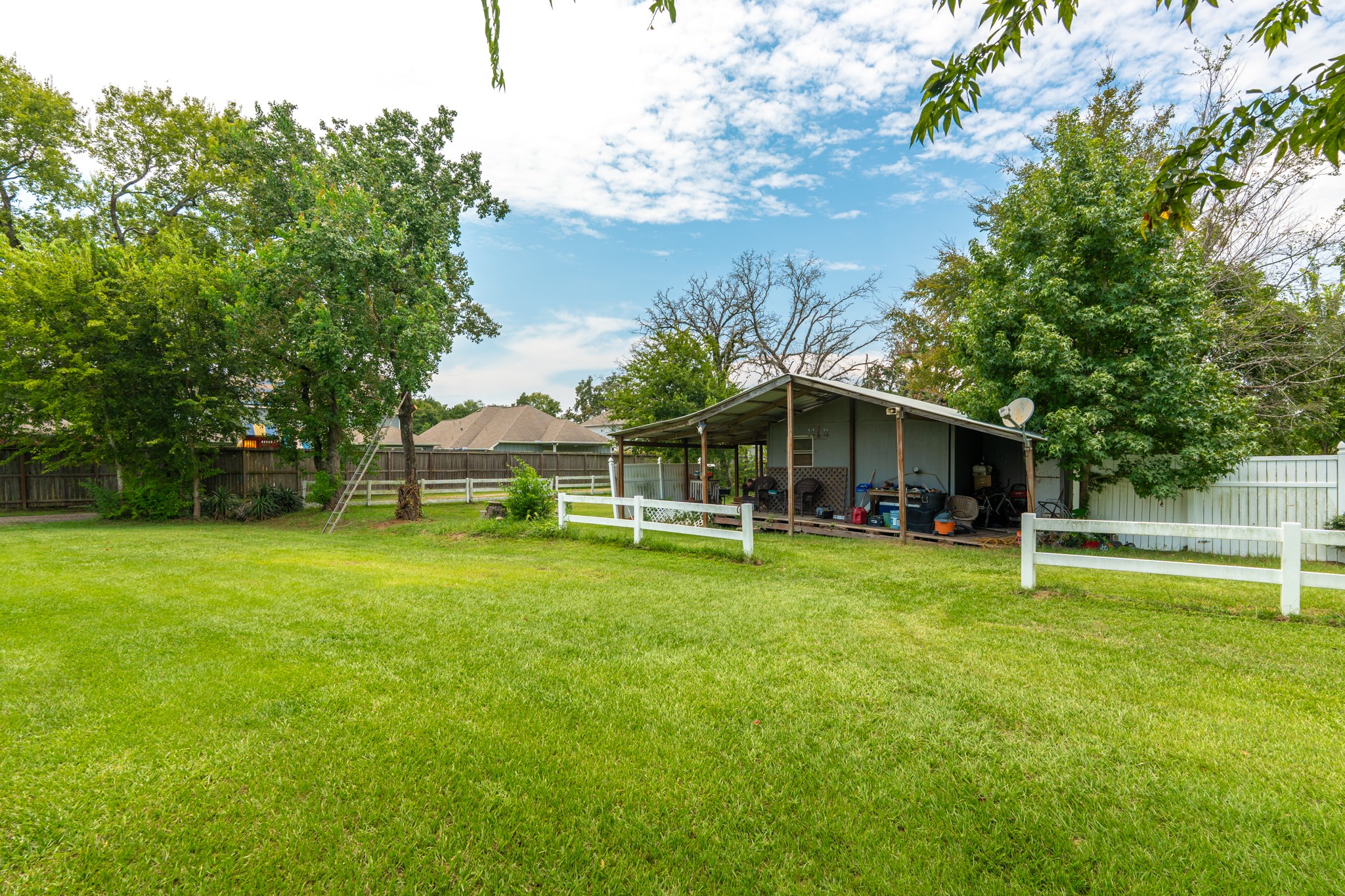 25635 Hufsmith Cemetery Road Tomball, TX 77375 - Photo 33 of 50 a view of a house with a yard porch and sitting area