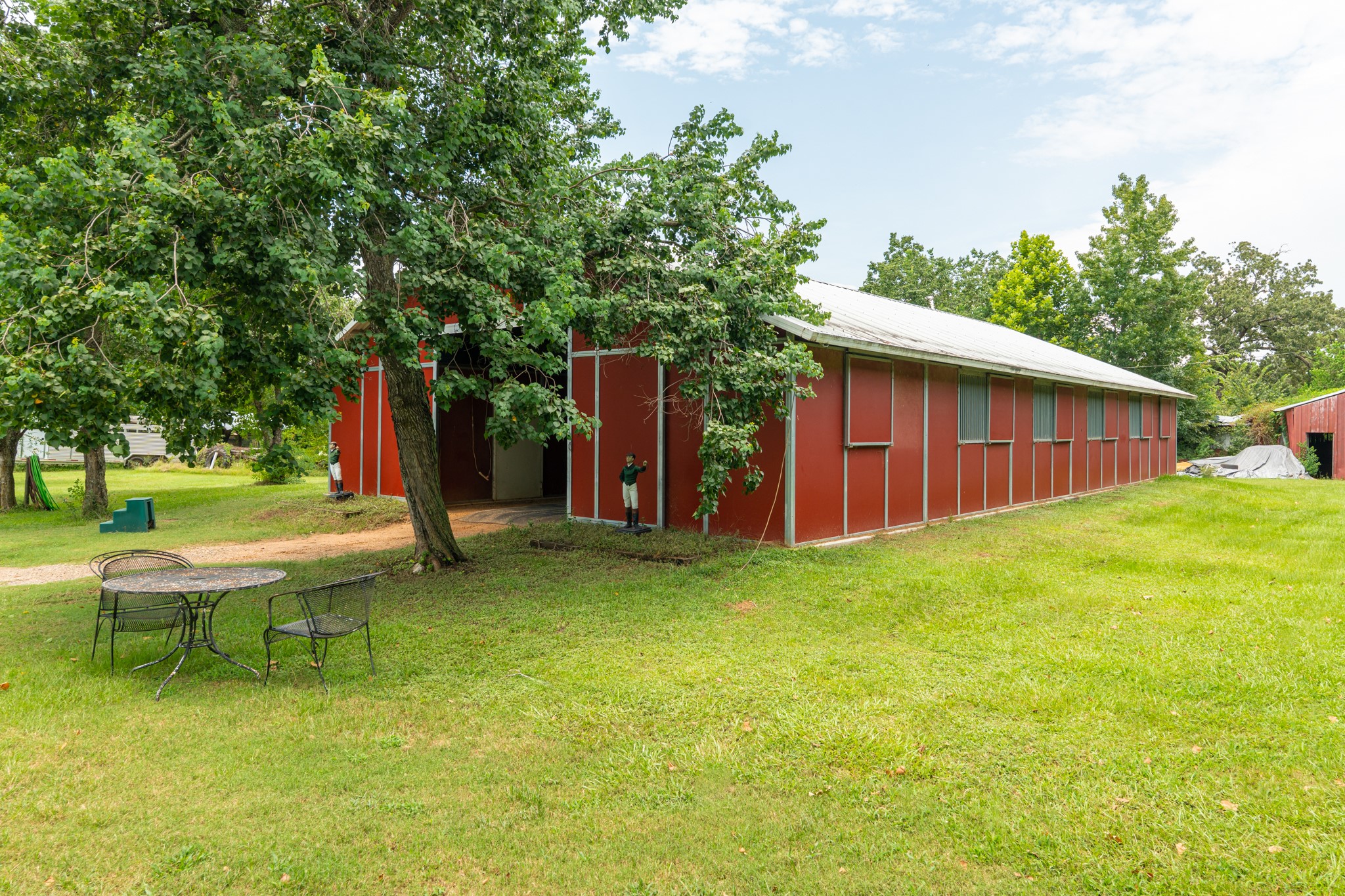 25635 Hufsmith Cemetery Road Tomball, TX 77375 - Photo 35 of 50 a view of a backyard with a garden and entertaining space