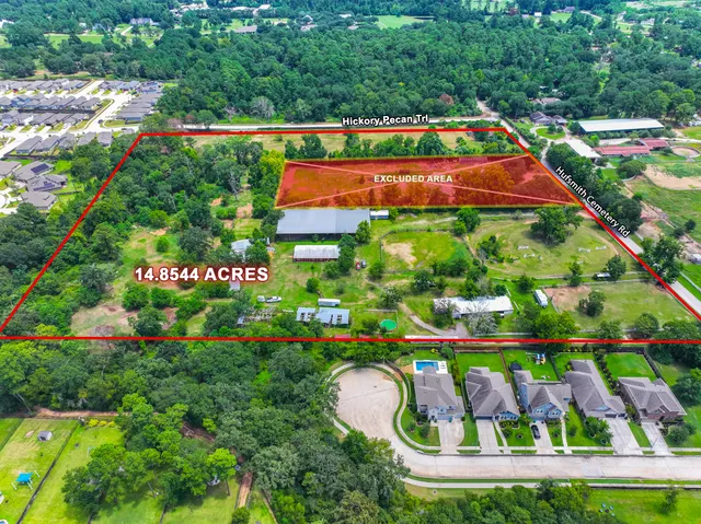 a view of a garden with an outdoor seating