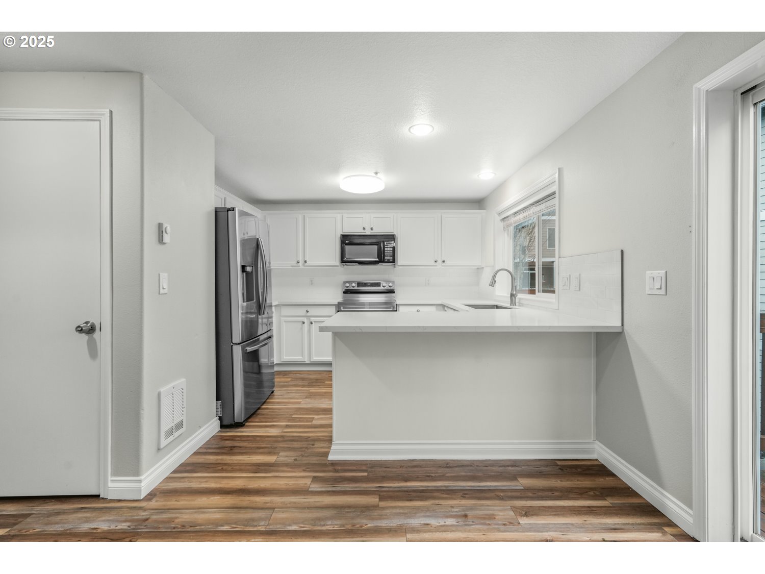 1244 Southwest 160th Avenue, Unit 104 Beaverton, OR 97006 - Photo 13 of 31 a kitchen with stainless steel appliances a refrigerator and a stove
