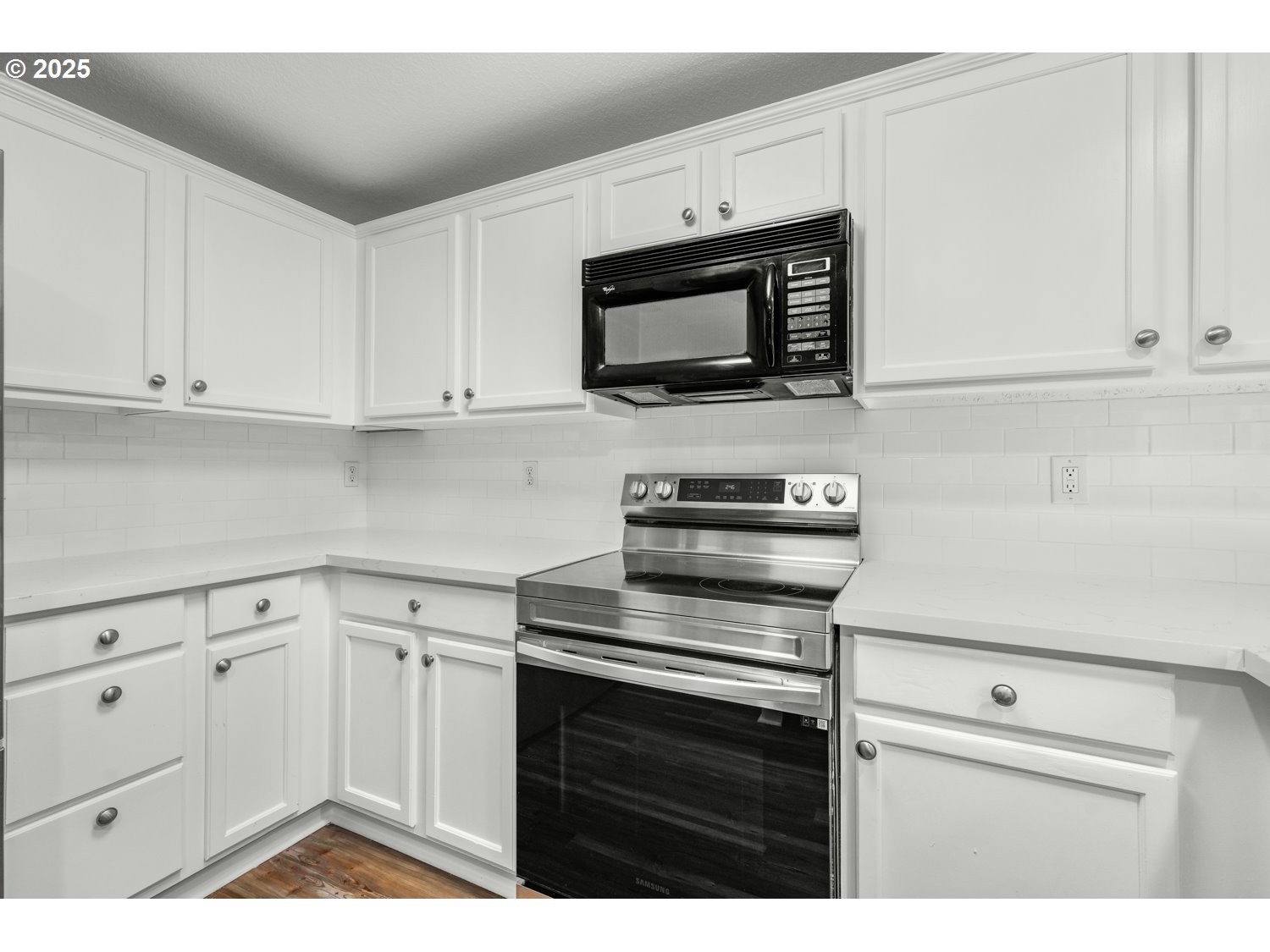 1244 Southwest 160th Avenue, Unit 104 Beaverton, OR 97006 - Photo 16 of 31 a kitchen with white cabinets and stainless steel appliances