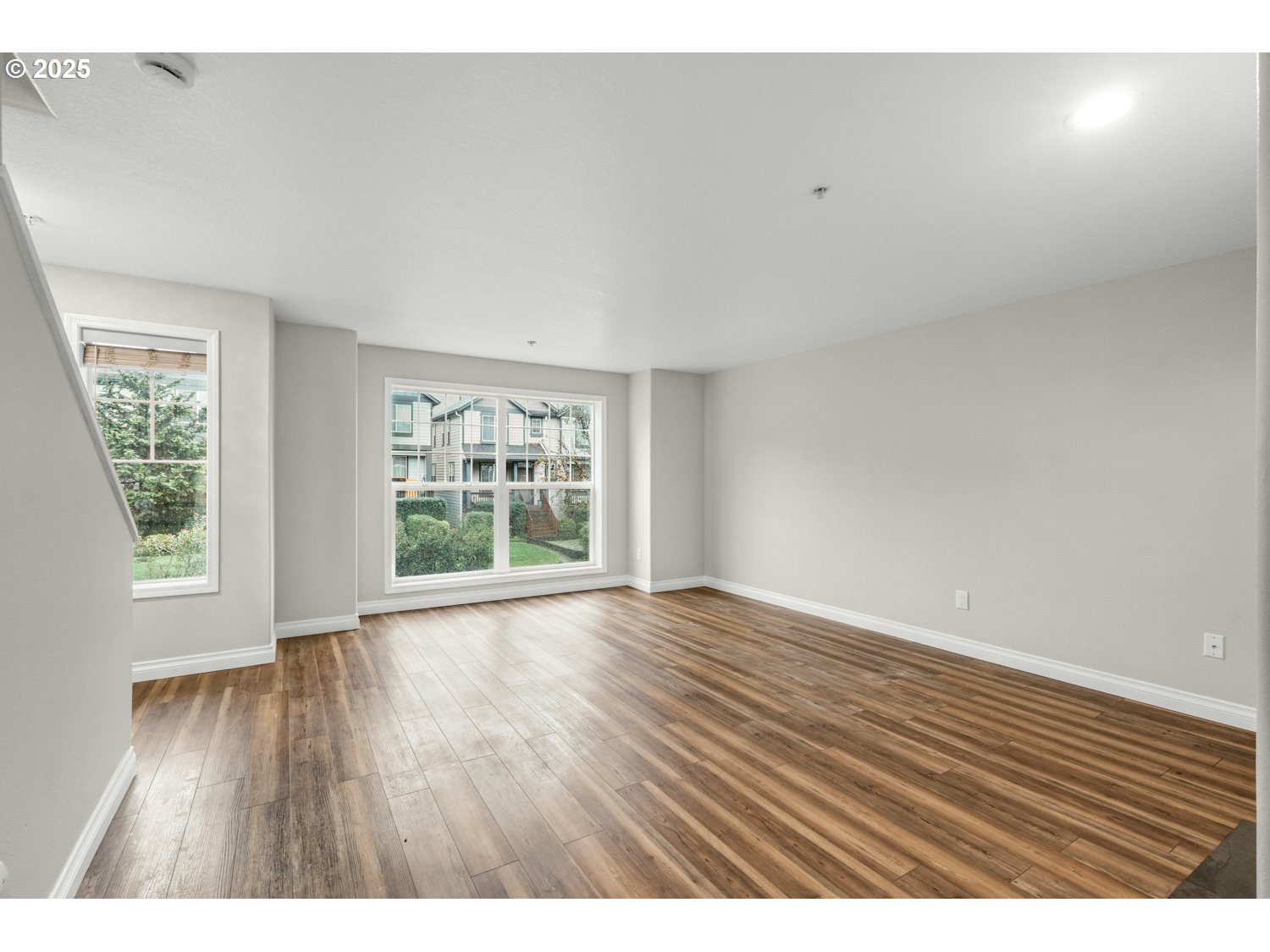 1244 Southwest 160th Avenue, Unit 104 Beaverton, OR 97006 - Photo 18 of 31 wooden floor in an empty room with a window