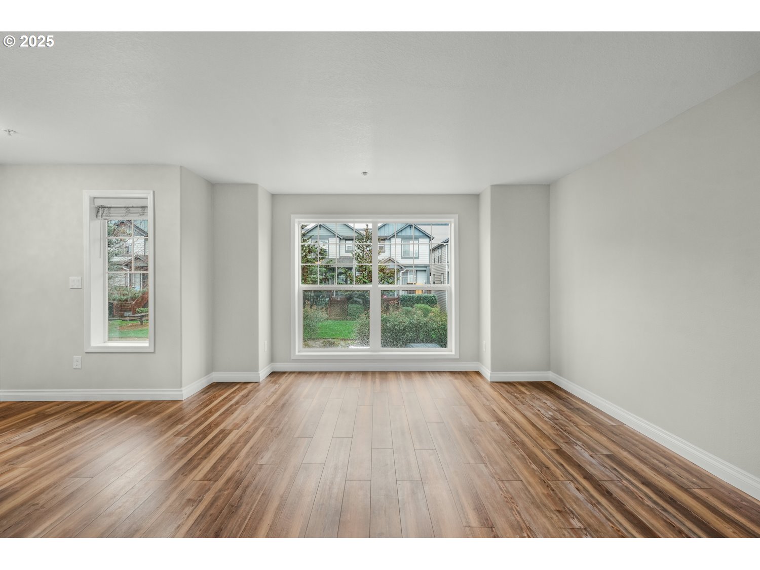 1244 Southwest 160th Avenue, Unit 104 Beaverton, OR 97006 - Photo 22 of 31 wooden floor in an empty room with a window