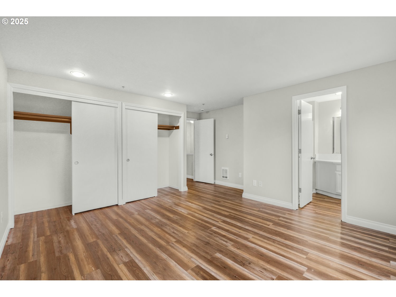1244 Southwest 160th Avenue, Unit 104 Beaverton, OR 97006 - Photo 29 of 31 a view of an empty room and wooden floor