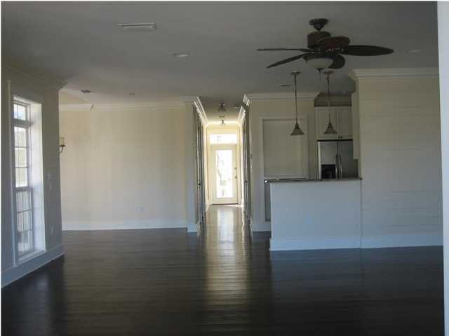 34 Grande Pointe Circle Inlet Beach, FL 32461 - Photo 5 of 14 a view of empty room with wooden floor and fan