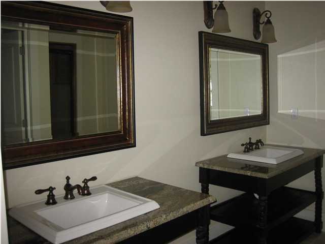 34 Grande Pointe Circle Inlet Beach, FL 32461 - Photo 8 of 14 a bathroom with a sink and a mirror