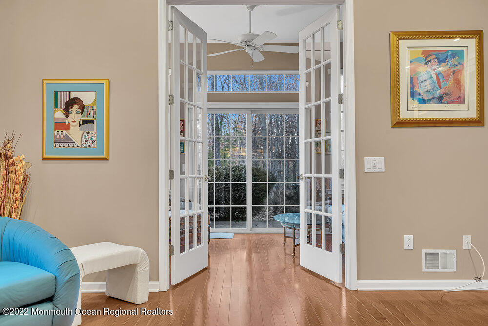 48 Winged Foot Road Jackson, NJ 08527 - Photo 26 of 69 a view of a hallway with couches and wooden floor