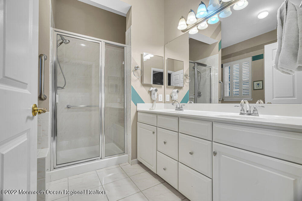 48 Winged Foot Road Jackson, NJ 08527 - Photo 38 of 69 a bathroom with a double vanity sink mirror and shower
