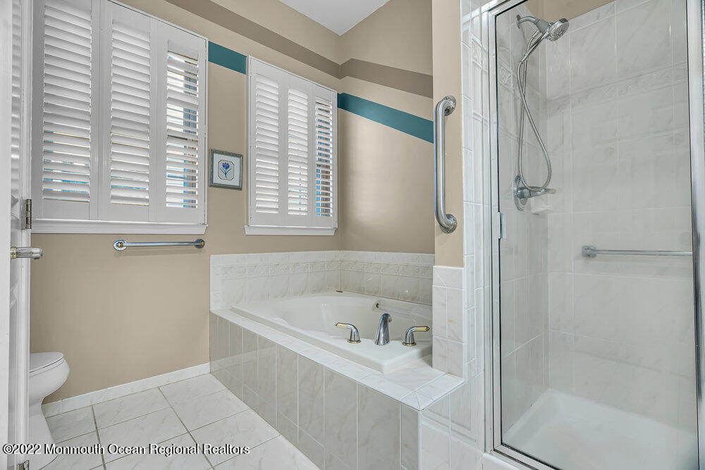 48 Winged Foot Road Jackson, NJ 08527 - Photo 40 of 69 a white bath tub sitting next to a white toilet