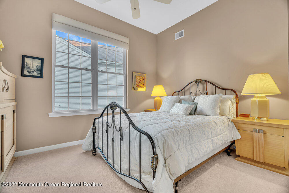 48 Winged Foot Road Jackson, NJ 08527 - Photo 42 of 69 a bedroom with a bed and a window