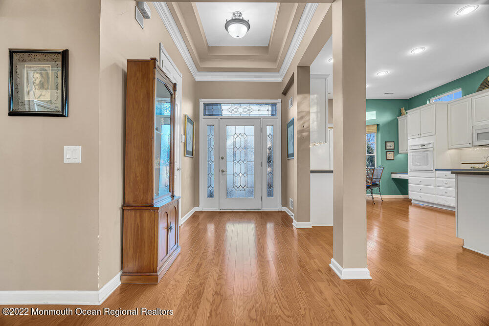 48 Winged Foot Road Jackson, NJ 08527 - Photo 9 of 69 a view of a hallway with wooden floor windows and a kitchen