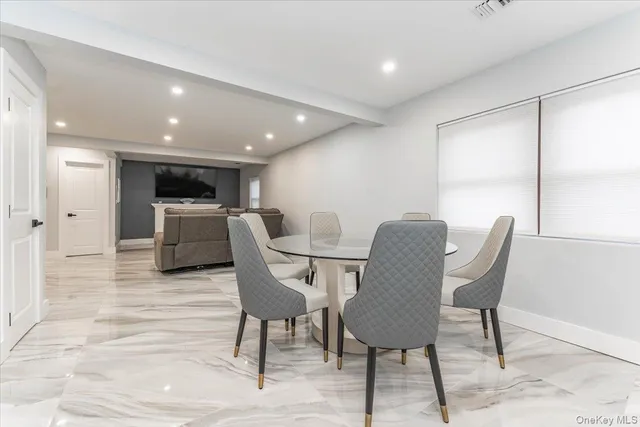 a view of a dining room with furniture